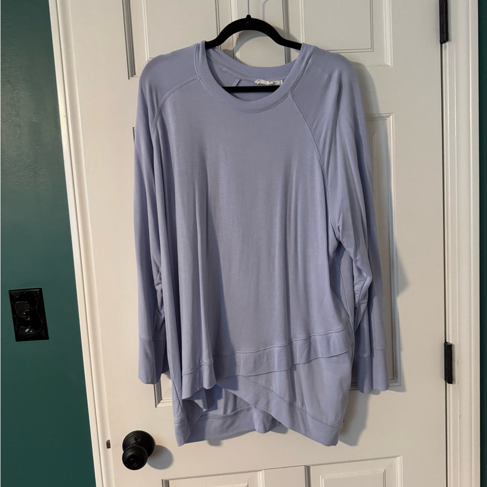 Women’s blue cross hem detail long sleeve top